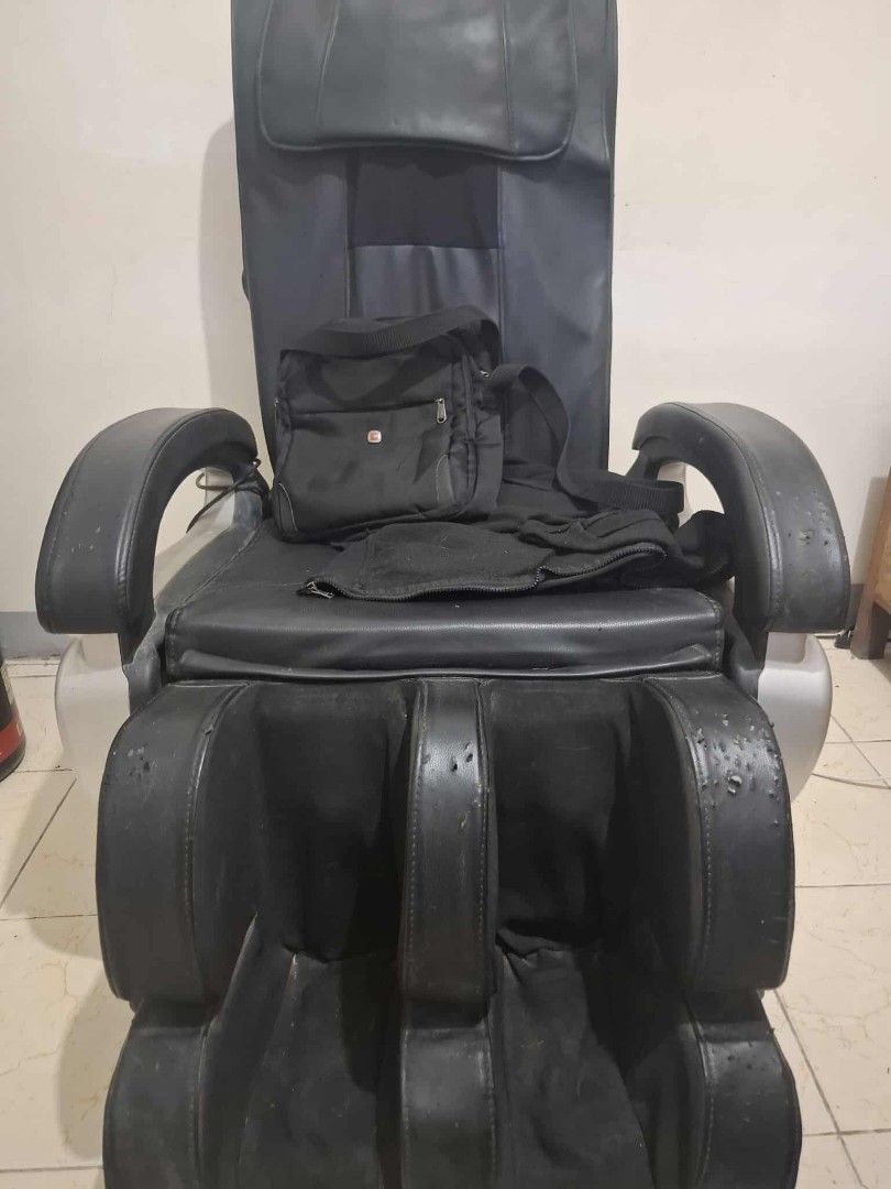 Massage Chair (Category: Massage Devices) located in Quezon City. Submitted by aicat0923 (Listing ID 1433409239, Image 2). Description: -Black Massage Chair -Integrated Foot Rest for added comfort -Offers Multiple massage function -designed fot relaxation and stress relief -Price Negotiable Issue -Scratches on Foot Rest.