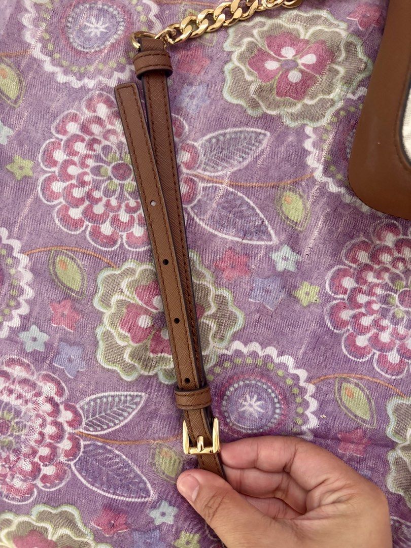 Michael Kors jet set Crossbody Bag (Category: Cross-body Bags) located in San Pedro. Submitted by mattchaaa (Listing ID 1433580097, Image 2). Description: - Michael Kors crossbody bag - Signature MK print - Brown trim - Gold-tone hardware - Detachable and adjustable strap - Chain strap included - Main compartment and slip pocket - Made in Cambodia.