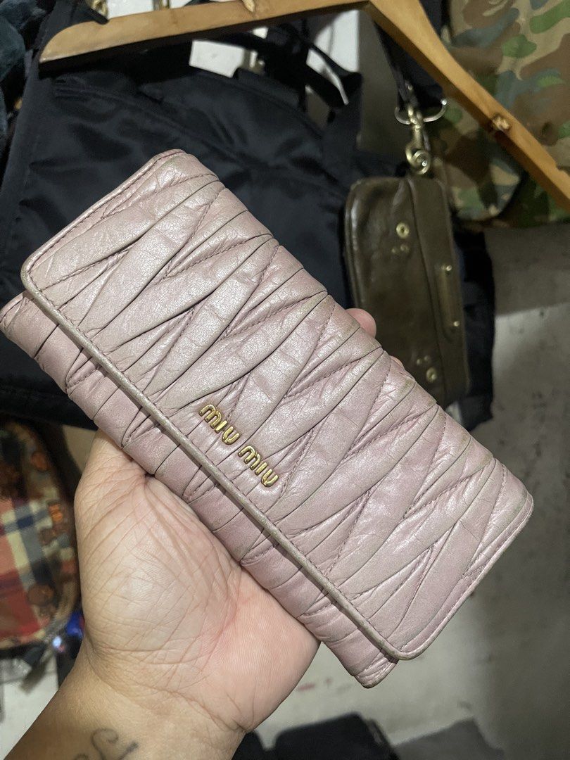 Miu Miu Quilted Leather Wallet (Category: Luxury Bags & Wallets) located in Mandaluyong City. Submitted by mark2pac (Listing ID 1433515890, Image 1). Description: - Authentic Miu Miu wallet - Soft, quilted leather - Light pink/mauve color - Gold Miu Miu logo - Fold-over design.
