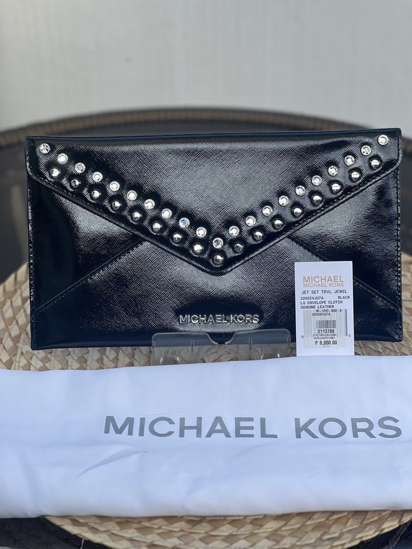 MK envelope clutch (Category: Luxury Bags & Wallets) located in Santa Rosa. Submitted by oohmai (Listing ID 1433541322, Image 2). Description: Color black rarely used Guaranteed authentic With minor flaws Shipping fee shouldered by the buyer Original price: 8,950 .
