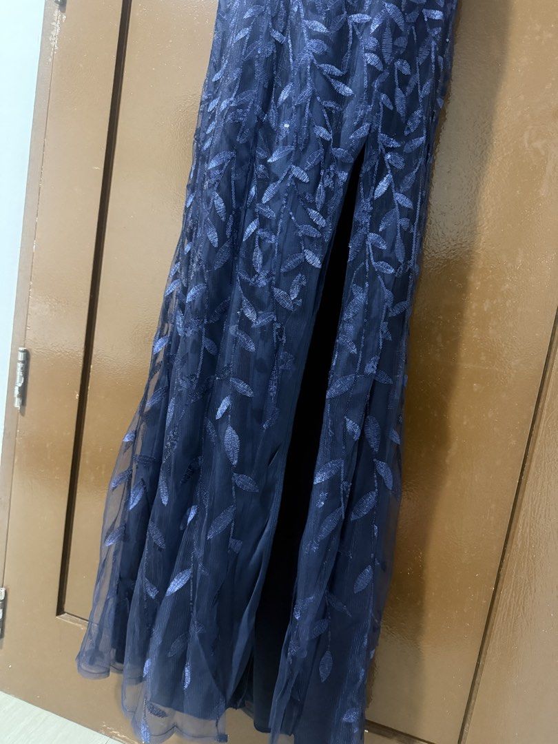 Navy Blue Halter Neck Evening Dress (Category: Evening dresses & gowns) located in Makati City. Submitted by naysan (Listing ID 1433528782, Image 3). Description: This is an almost new evening dress, worn only once in an event. - Navy blue evening dress - Halter neck design - Thigh-high slit - Flowing skirt - Criss-cross back straps Size is stretchable medium, so this will fit event medium. Please refer to last photo for actual look when worn..
