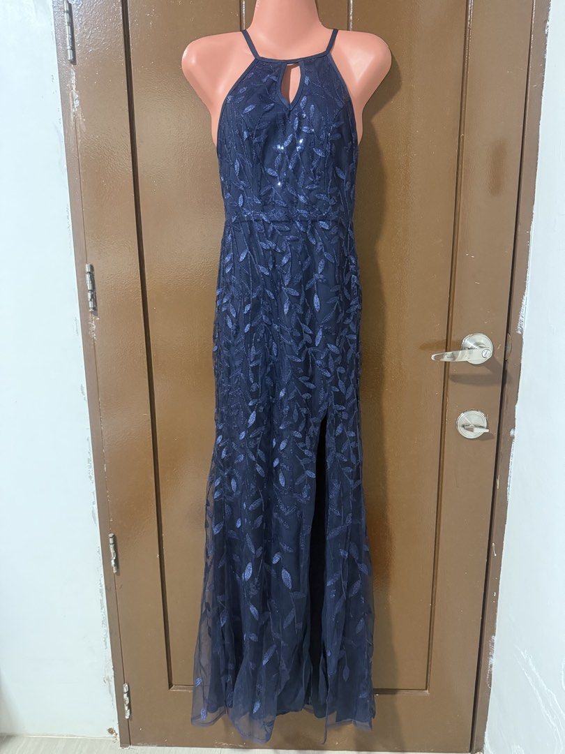 Navy Blue Halter Neck Evening Dress (Category: Evening dresses & gowns) located in Makati City. Submitted by naysan (Listing ID 1433528782, Image 1). Description: This is an almost new evening dress, worn only once in an event. - Navy blue evening dress - Halter neck design - Thigh-high slit - Flowing skirt - Criss-cross back straps Size is stretchable medium, so this will fit event medium. Please refer to last photo for actual look when worn..