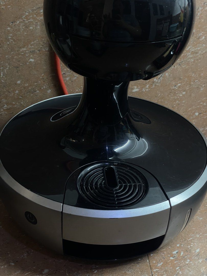 Nescafe Dolce Gusto Coffee Machine (Category: Coffee Machines & Makers) located in Quezon City. Submitted by sashiimii1720 (Listing ID 1433559847, Image 3). Description: - Nescafe Dolce Gusto coffee machine - Color: Black and Silver - Unique spherical design - Power button and water reservoir - Model: 9774 - Voltage: 220-240V - Frequency: 50/60Hz.