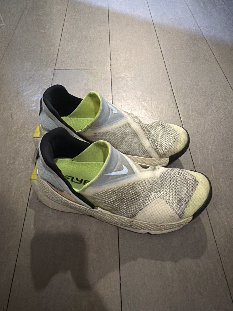 Nike FlyEase Slip-On Sneakers (Category: Sneakers) located in Makati City. Submitted by mledeclutter (Listing ID 1433428563, Image 1). Description: - Nike FlyEase slip-on design - White and gray mesh upper - Black collar - Neon green inner lining - White soles with black accents - Nike logo visible - Designed for comfort and ease of wear Womens. As is .