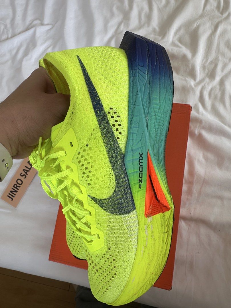 Nike ZoomX Vaporfly Next% 3 - Volt (Category: Sneakers) located in Mandaluyong City. Submitted by jinroo (Listing ID 1433458862, Image 2). Description: - Nike ZoomX Vaporfly Next% 3 running shoes - Color: Volt Green - Size: US 11.5, UK 10.5, EUR 45.5, CM 29.5 - Features: Breathable Flyknit upper, ZoomX foam cushioning - Sole: Blue and green with orange accents - Includes original box USED ONCE ONLY FOR 5KM RUN FOR ONLY ₱5,000.00 Nego sa sure buye