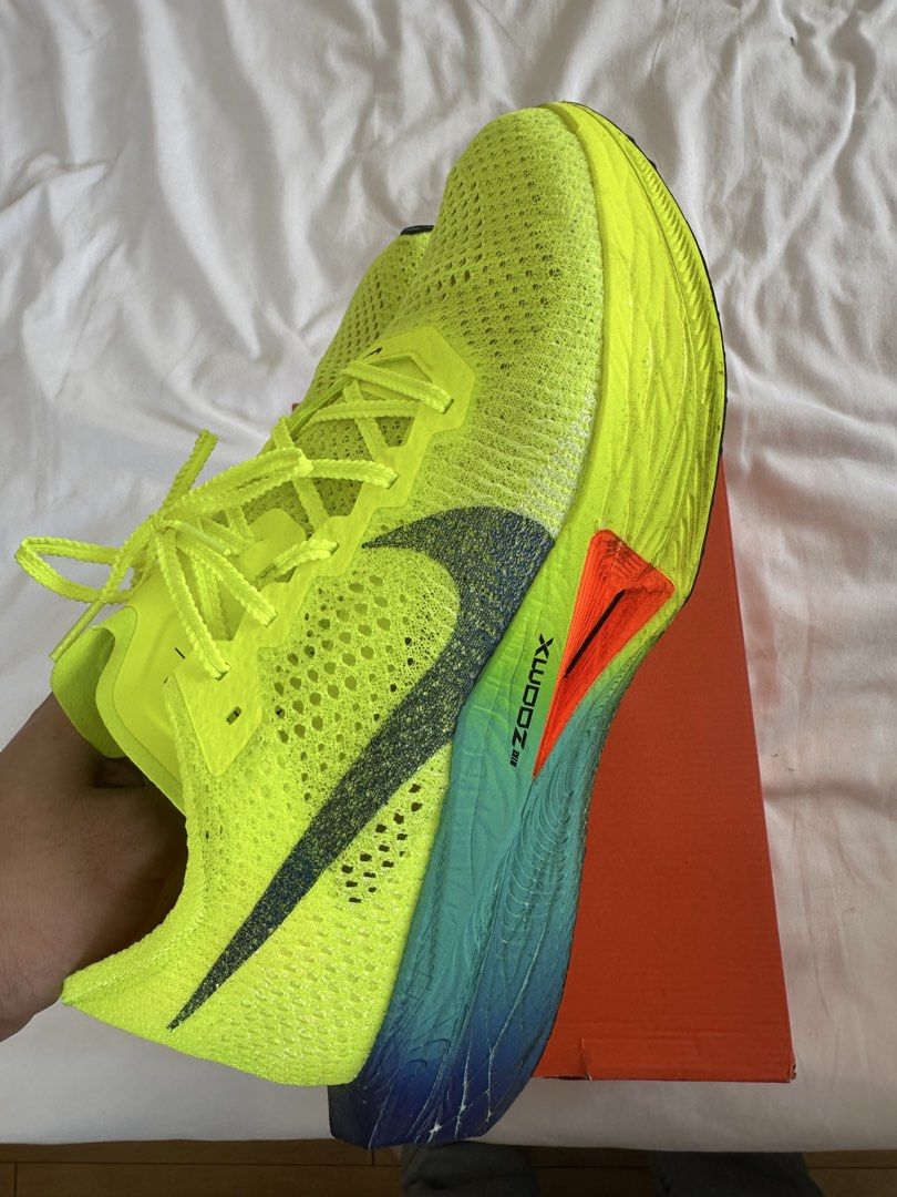 Nike ZoomX Vaporfly Next% 3 - Volt (Category: Sneakers) located in Mandaluyong City. Submitted by jinroo (Listing ID 1433458862, Image 3). Description: - Nike ZoomX Vaporfly Next% 3 running shoes - Color: Volt Green - Size: US 11.5, UK 10.5, EUR 45.5, CM 29.5 - Features: Breathable Flyknit upper, ZoomX foam cushioning - Sole: Blue and green with orange accents - Includes original box USED ONCE ONLY FOR 5KM RUN FOR ONLY ₱5,000.00 Nego sa sure buye