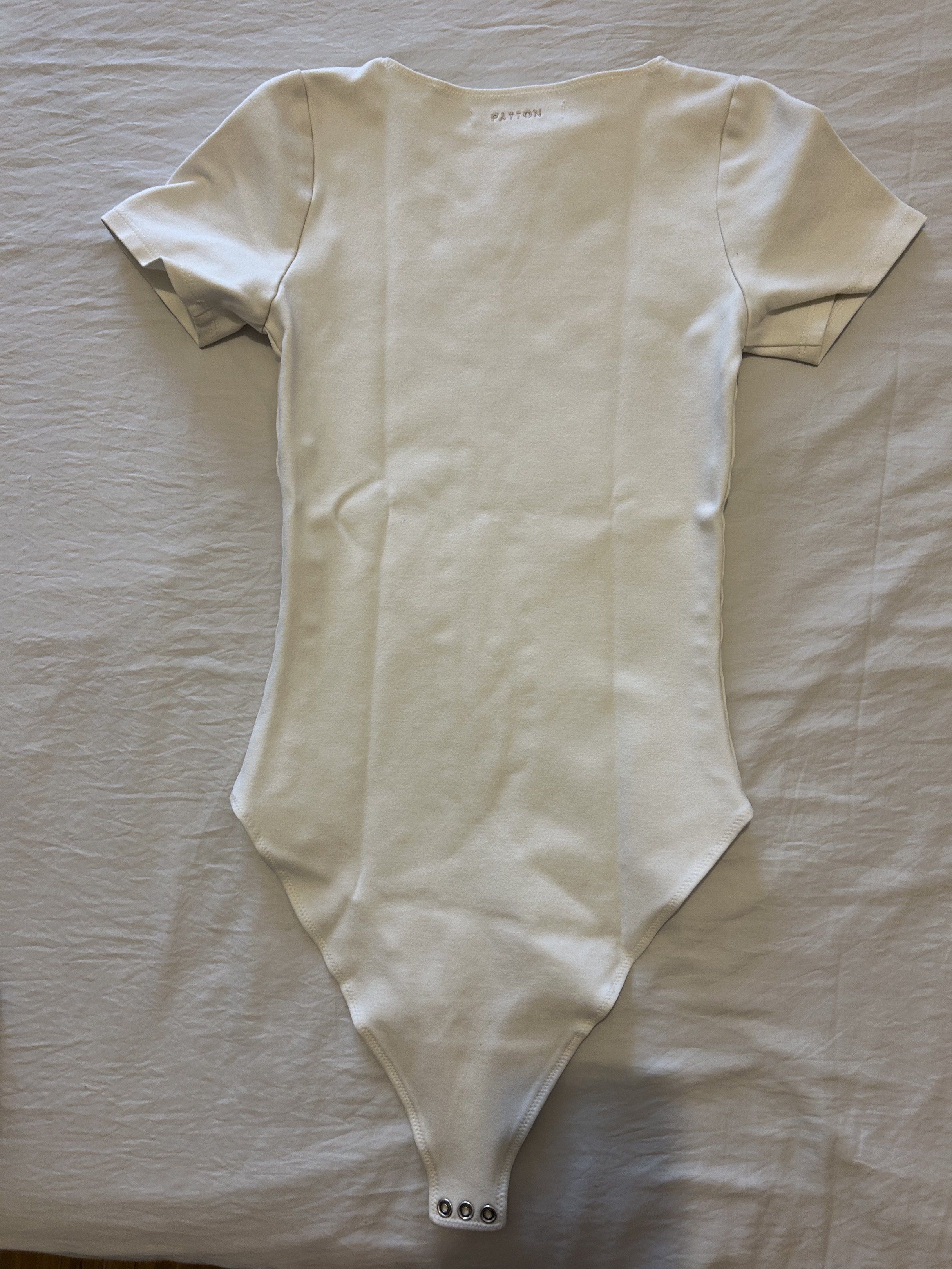 Patton White Bodysuit XS (Category: Others Tops) located in Quezon City. Submitted by simplifiedclosetph (Listing ID 1433494816, Image 3). Description: Patton black bodysuit - Crew neckline and short sleeves - Snap closure - Size: XS - Color: White Can send more photos upon request No tape measure available :( If applicable, refer the the brand’s website for sizing reference RFS: Got married, major decluttering as we moved to a new space! :) MOP: