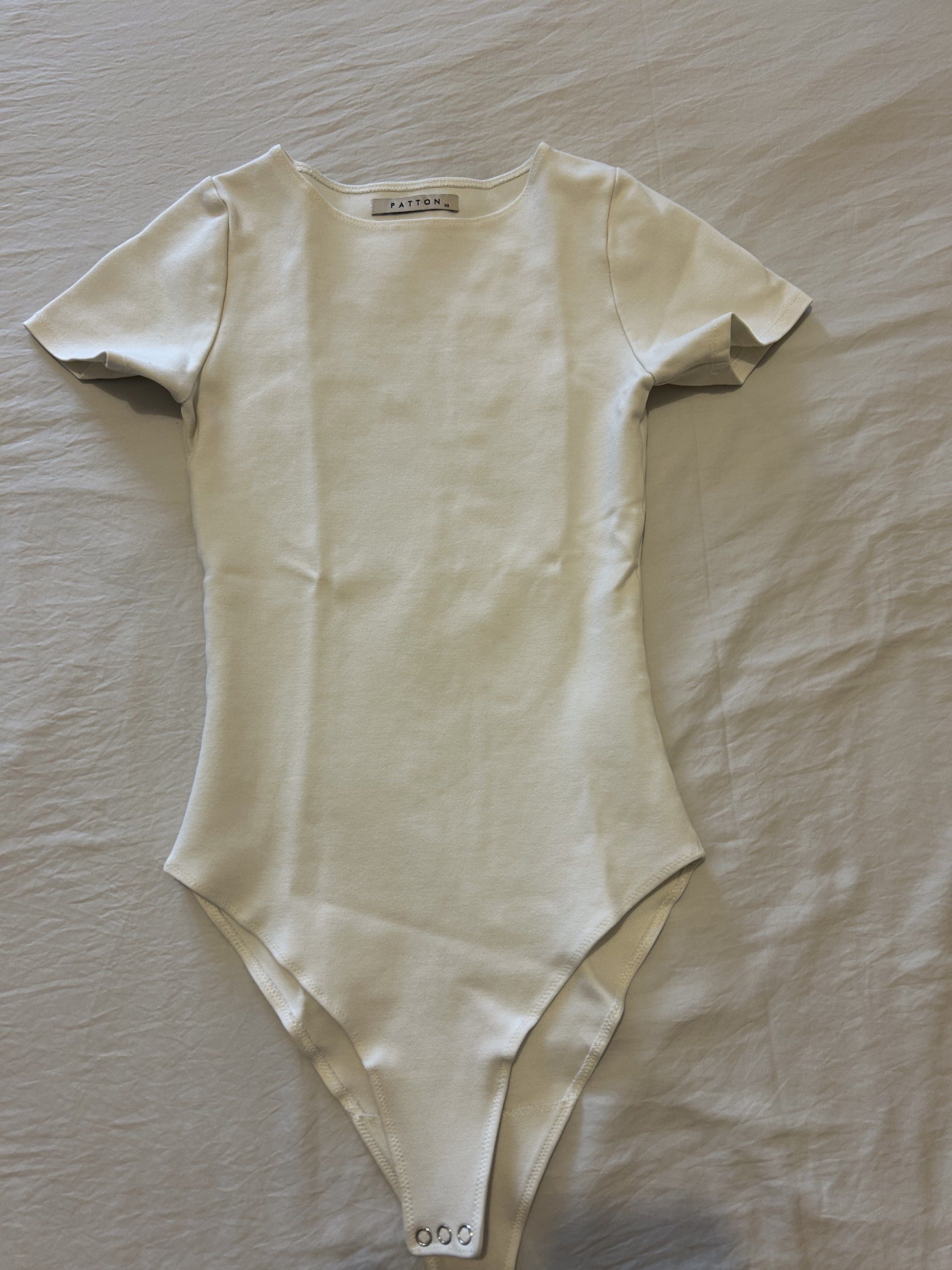 Patton White Bodysuit XS (Category: Others Tops) located in Quezon City. Submitted by simplifiedclosetph (Listing ID 1433494816, Image 1). Description: Patton black bodysuit - Crew neckline and short sleeves - Snap closure - Size: XS - Color: White Can send more photos upon request No tape measure available :( If applicable, refer the the brand’s website for sizing reference RFS: Got married, major decluttering as we moved to a new space! :) MOP: