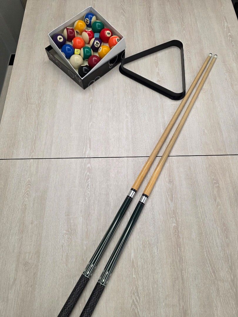 Dining table + Pool table (Category: Tables & Sets) located in Singapore. Submitted by zuluechoecho13 (Listing ID 1433515189, Image 1). Description: Dining table + Pool Table all in one. Includes a full set of pool balls, two cues, and a triangle rack. 2 benches also included. The table features a light wood finish with a black frame and black felt. Perfect for game nights! 6ft (183cm(L) x 106cm(W) x 81cm(H) arrange own delivery please.