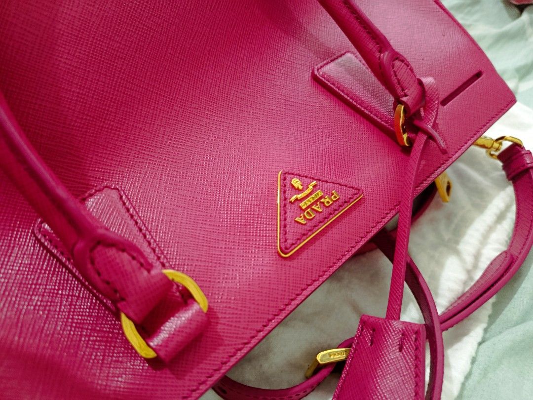 Prada Saffiano Lux (Category: Luxury Bags & Wallets) located in Manila. Submitted by zjdelacruz16 (Listing ID 1433469232, Image 3). Description: Prada Saffiano Lux Fuxia brandnew (never been used) complete with bag cover and documents asking price: 33k negotiate.