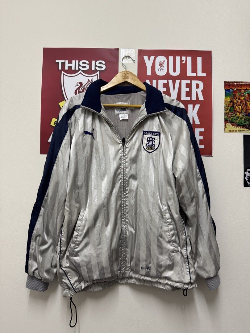 Puma Buffer Track Jacket (Category: Coats, Jackets and Outerwear) located in Sungai Buloh. Submitted by goodinsthrift (Listing ID 1433566493, Image 1). Description: Condition as pictured 8/10 Defects: Pulls at the backside with minor stains Measurements: 23 x 28 inches 🤌🏻.