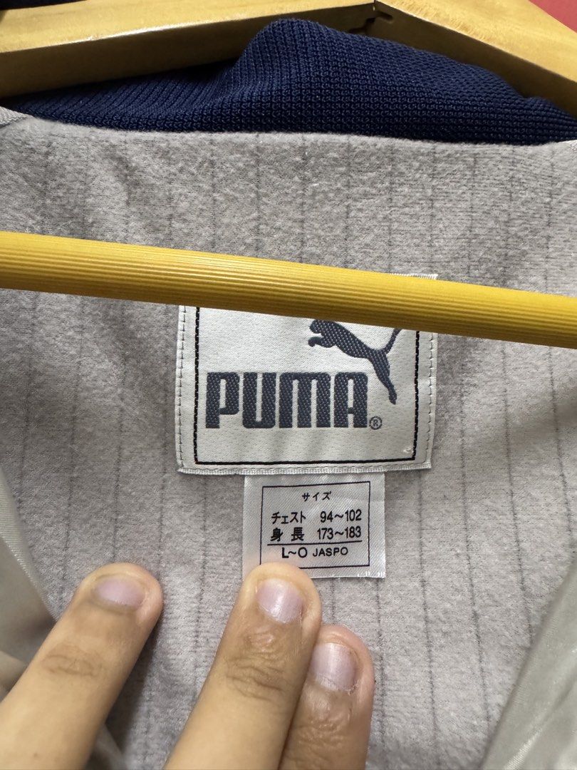 Puma Buffer Track Jacket (Category: Coats, Jackets and Outerwear) located in Sungai Buloh. Submitted by goodinsthrift (Listing ID 1433566493, Image 3). Description: Condition as pictured 8/10 Defects: Pulls at the backside with minor stains Measurements: 23 x 28 inches 🤌🏻.