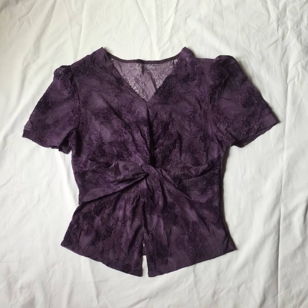 Purple lace blouse with short sleeves (Category: Sleeveless) located in Koronadal. Submitted by hashiecoll22 (Listing ID 1433376919, Image 2). Description: No issues! Super ganda in person 😍 Pwede hanggang medium size - Purple textured fabric - V-neckline - Short sleeves - Twist front detail - Lightweight material - Flattering silhouette.
