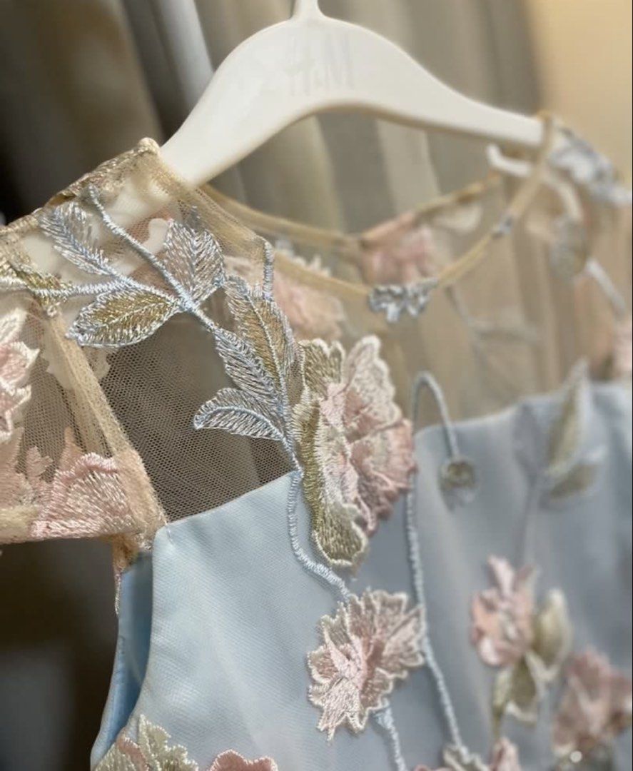 Rare Editions Floral Dress (Category: Dresses) located in Manila. Submitted by primemover2 (Listing ID 1433414978, Image 3). Description: - Rare, beautiful dress - Intricate floral embroidery - Light blue base with pink and gold accents - Features a jeweled belt - Sheer overlay on bodice and sleeves - Zipper closure at back - Ribbon tie detail - Ideal for special occasions.