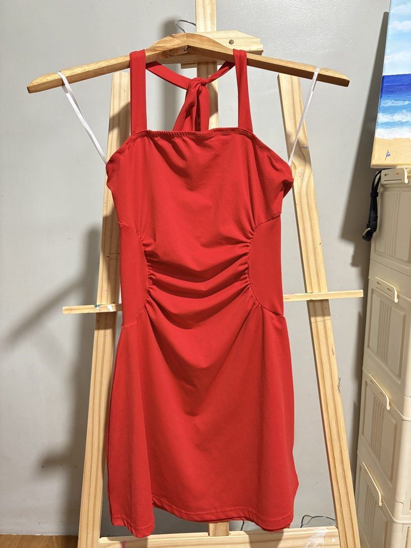 Red Halter Dress (Category: Dresses) located in Pasig City. Submitted by petite_declutter (Listing ID 1433482113, Image 2). Description: - Red halter dress - Fitted silhouette - Ruched side detail - Smooth fabric - Versatile for various occasions.