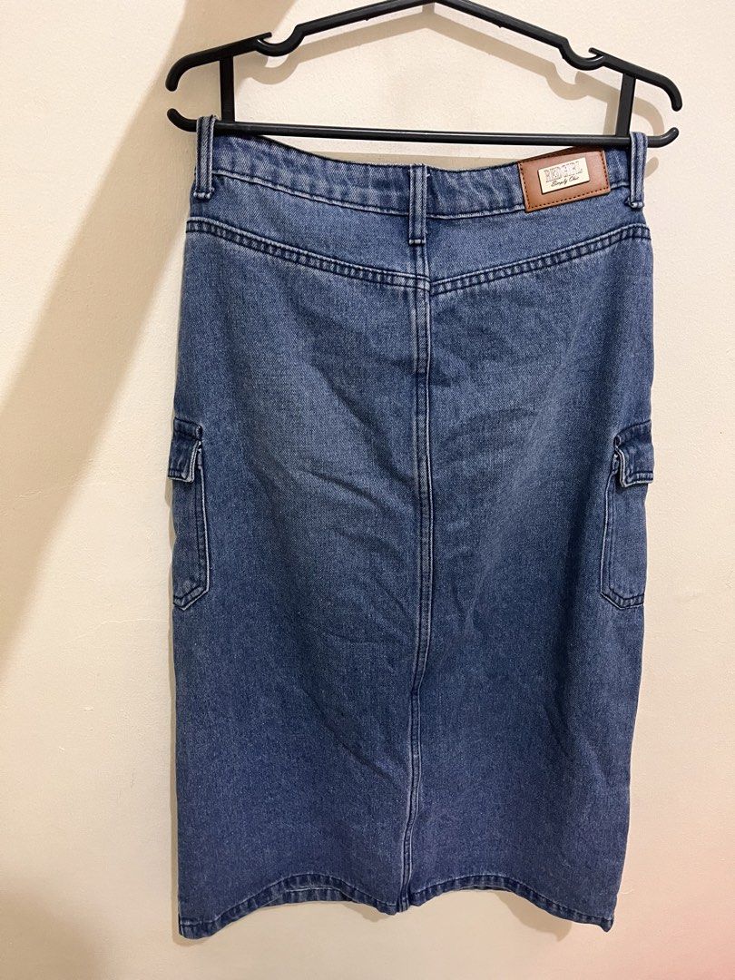Redgirl Denim Cargo Skirt (Category: Skirts) located in Pasig City. Submitted by marjorieinumerable (Listing ID 1433465628, Image 2). Description: - Redgirl denim cargo skirt - Classic blue wash - Size 27 - Two front cargo pockets - Front slit - Button and zipper closure - Leather patch at the back - Perfect for casual wear.