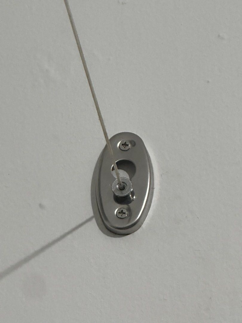 Retractable Clothesline (Category: Home Improvement Tools & Accessories) located in Manila. Submitted by keishache04272 (Listing ID 1433453236, Image 2). Description: Retractable clothesline is perfect for small spaces. It features a stainless steel design and includes the main unit and the receiving end. The clothesline extends and retracts easily. It is designed to be mounted on opposite walls. The unit has a lock and unlock mechanism for conve