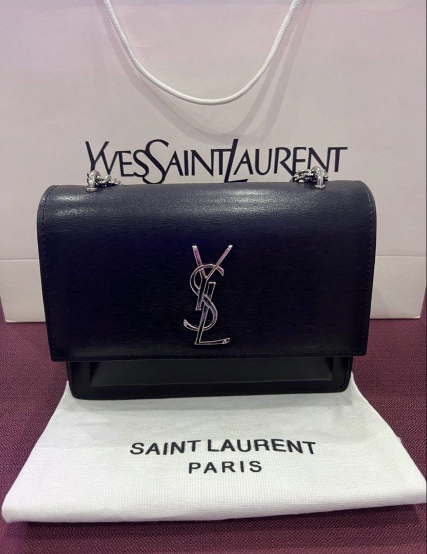 Saint Laurent Black Chain Bag (Category: Luxury Bags & Wallets) located in Cavite. Submitted by xzicollections (Listing ID 1433439227, Image 1). Description: - Authentic Saint Laurent Chain Bag - Silver-tone hardware - Iconic YSL logo - Flap closure - Interior with multiple compartments and slip pocket - Chain strap for shoulder or crossbody wear - Includes dust bag Selling it Low price, just 📩 Additional Photos Available upon Request.