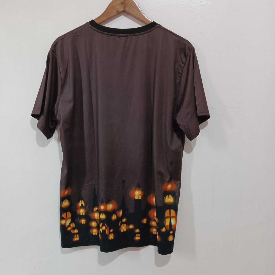 Shein short-sleeved t-shirt large (Category: Tshirts & Polo Shirts ) located in Subic. Submitted by mustardt_ (Listing ID 1433487772, Image 2). Description: item is a short-sleeved t-shirt featuring a 3D sublimation print of a nighttime cityscape with glowing windows and the word "NIGHT" on the chest size: w21.5in x l28in code: c454.