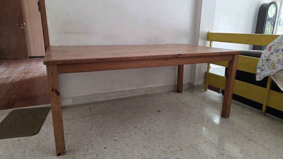 Solid Wood Dining Table (Category: Tables & Sets) located in Singapore. Submitted by tubbie (Listing ID 1433539574, Image 1). Description: - Solid wood dining table - Includes a chip on the edge - Still sturdy and functional - Ideal for dining or as a large desk - Self-collection only.
