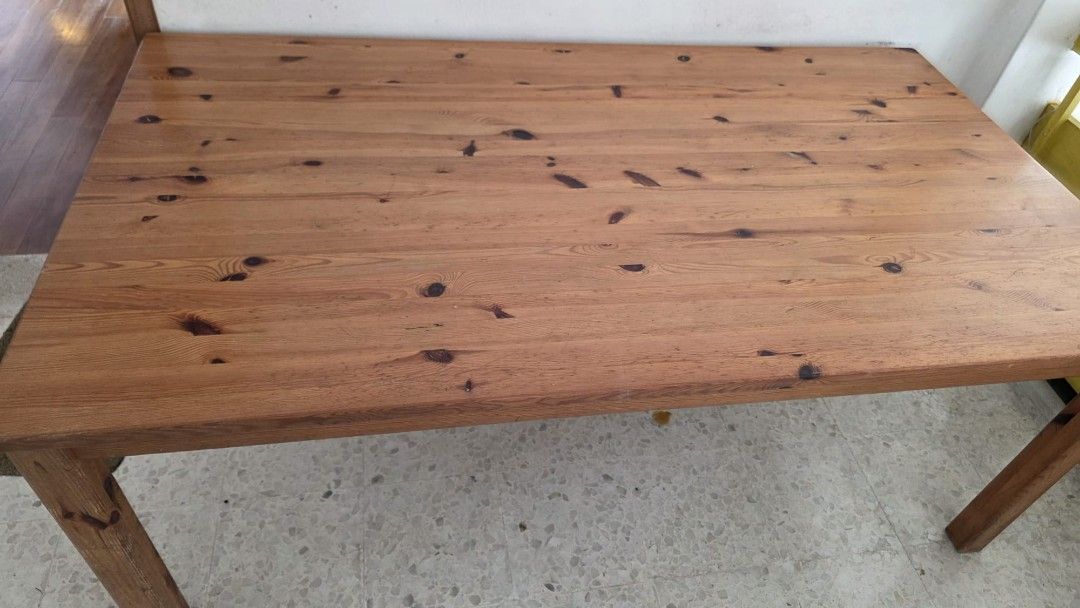 Solid Wood Dining Table (Category: Tables & Sets) located in Singapore. Submitted by tubbie (Listing ID 1433539574, Image 2). Description: - Solid wood dining table - Includes a chip on the edge - Still sturdy and functional - Ideal for dining or as a large desk - Self-collection only.