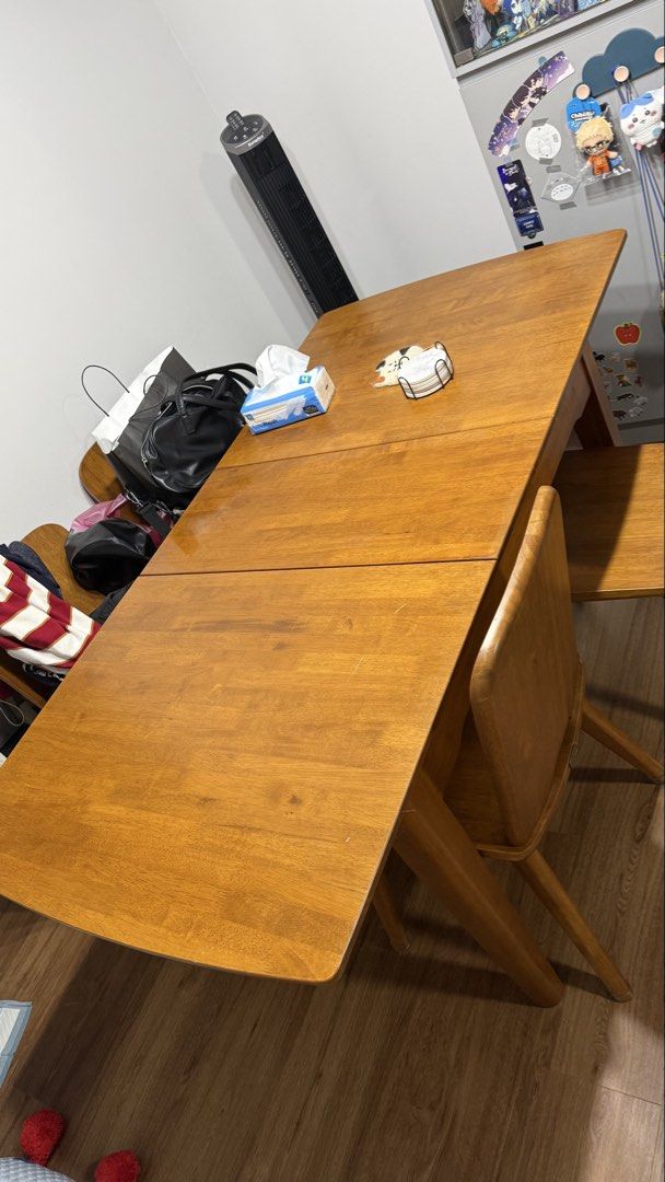 Solid wood extendable table (Category: Tables & Sets) located in Singapore. Submitted by melcrazychan (Listing ID 1433507196, Image 2). Description: Solid wood table and chairs, owned for almost 3 years. Rough Dimensions: ~130cm (before extending) ~162cm (after extending) W ~80cm H ~76cm There are visible scratches and indents from regular use. I’m not sure how you can dismantle since there is the mechanism underneath to extend. Originally bought