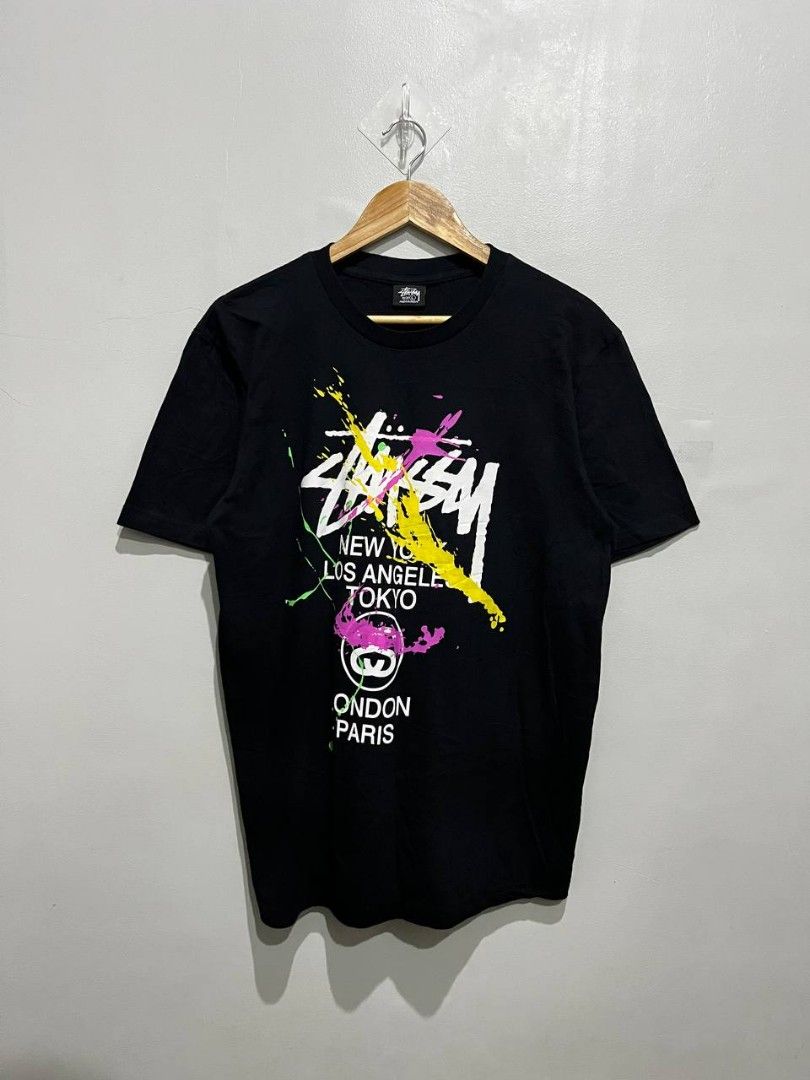 Stussy Graphic Tee - Black - Size L (Category: Tshirts & Polo Shirts ) located in Balatan. Submitted by classifinds (Listing ID 1433430425, Image 3). Description: 21 / 27 - Stussy t-shirt - Size: L - Features a colorful graphic design on front and back - Includes Stussy logo and city names - Made in Mexico - Material: 100% cotton - Care: Machine wash and tumble dry.