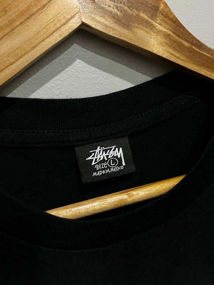 Stussy Graphic Tee - Black - Size L (Category: Tshirts & Polo Shirts ) located in Balatan. Submitted by classifinds (Listing ID 1433430425, Image 2). Description: 21 / 27 - Stussy t-shirt - Size: L - Features a colorful graphic design on front and back - Includes Stussy logo and city names - Made in Mexico - Material: 100% cotton - Care: Machine wash and tumble dry.