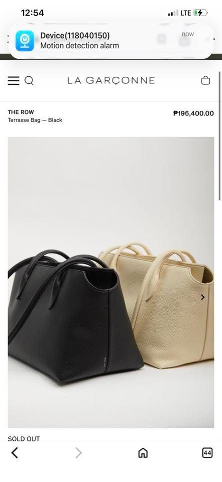 The Row Terrasse Bag - Black (Category: Luxury Bags & Wallets) located in Roxas City. Submitted by lynngreyartillero (Listing ID 1433463121, Image 2). Description: - The Row Terrasse Bag in classic black. - Sleek, rectangular design. - Features a top handle for easy carrying. - Secure zip closure. - Spacious interior. - Crafted in Italy. - Made from luxurious, textured leather. - The Row branding subtly displayed..