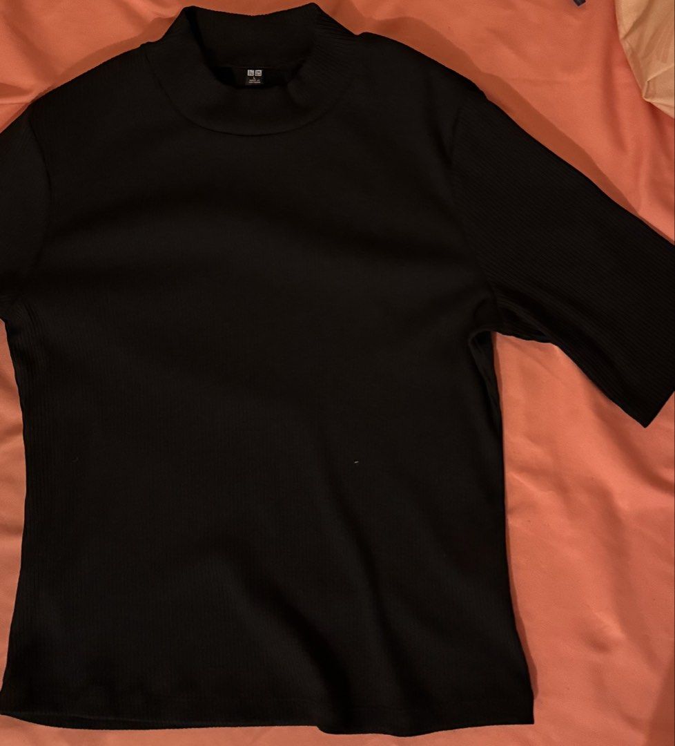 Uniqlo Ribbed Mock Neck Black (Category: Shirts) located in Quezon City. Submitted by pjsitems (Listing ID 1433574438, Image 1). Description: - Uniqlo black ribbed top - mock neck design - Short sleeves - can send more pictures - strictly no when worn photos.