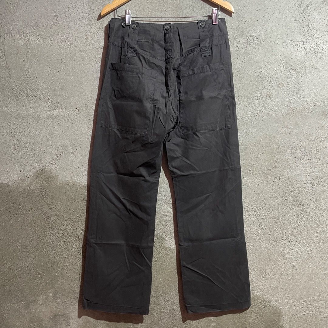 Vivienne Westwood Anglomania Multipocket Pants (Category: Jeans) located in Enrique B. Magalona (Saravia). Submitted by artisan.ph (Listing ID 1433561210, Image 2). Description: - Vivienne Westwood Anglomania pants - Dark grey color - Wide-leg design - Size 40 - Made in Italy - Multiple pockets - Unique button details with Vivienne Westwood logo - Tailored fit.