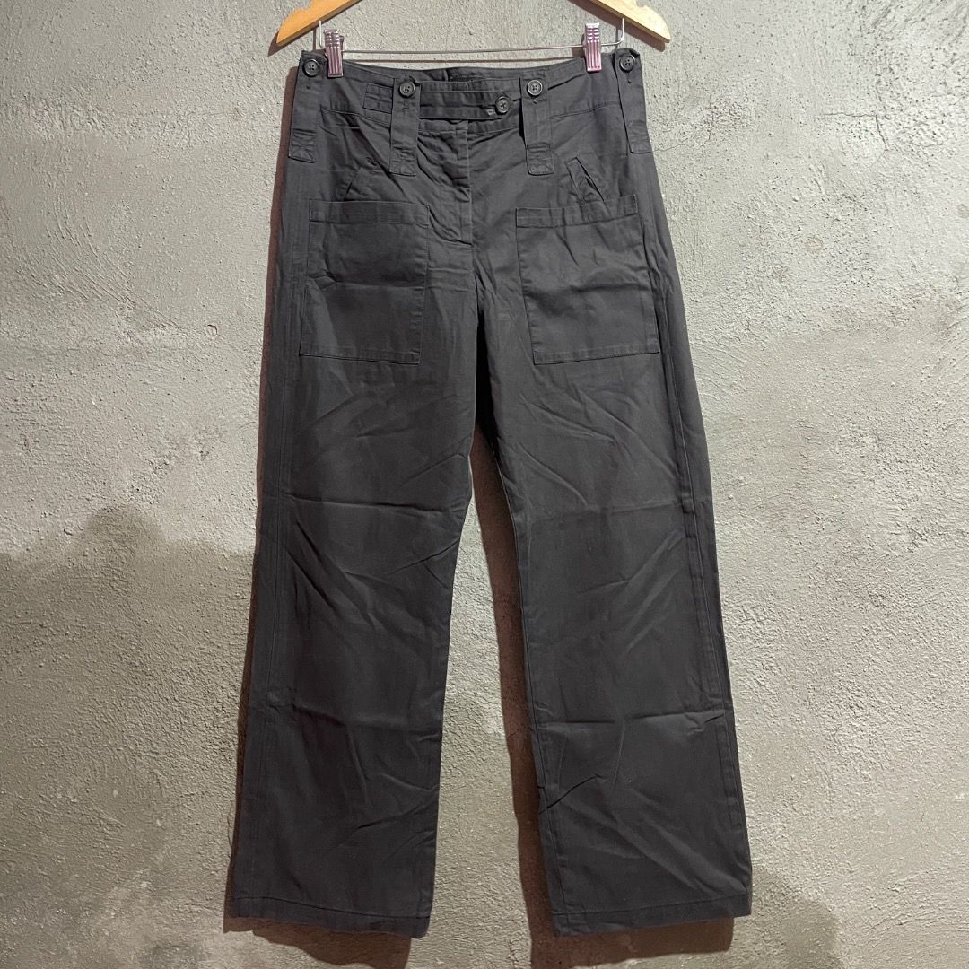 Vivienne Westwood Anglomania Multipocket Pants (Category: Jeans) located in Enrique B. Magalona (Saravia). Submitted by artisan.ph (Listing ID 1433561210, Image 1). Description: - Vivienne Westwood Anglomania pants - Dark grey color - Wide-leg design - Size 40 - Made in Italy - Multiple pockets - Unique button details with Vivienne Westwood logo - Tailored fit.