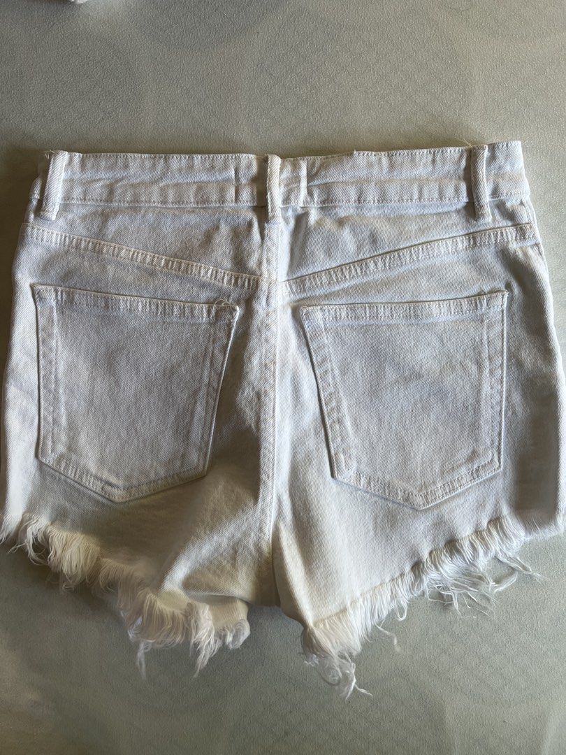Zara High Waist White Denim Shorts (Category: Shorts) located in Quezon City. Submitted by byyyee (Listing ID 1433483003, Image 2). Description: - Decluttering -Fave white shorts but have too many already hence why i'm selling - Classic five-pocket design - Zip fly and button closure - Frayed hem.