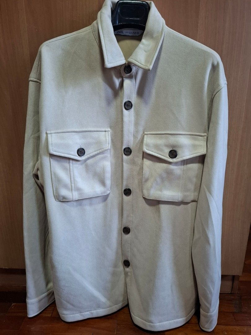 Zara Overshirt Jacket (Category: Coats, Jackets and Outerwear) located in Makati City. Submitted by itemsforless2025 (Listing ID 1433477486, Image 1). Description: Stylish overshirt jacket from Zara. Features a neutral color, two chest pockets, and button-down closure. The jacket has a classic collar and long sleeves. Perfect for layering and adding a touch of sophistication to any outfit. Versatile and suitable for various occasions..