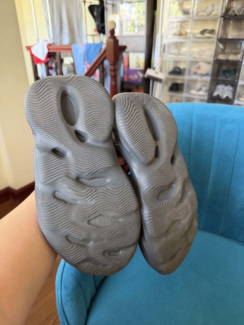 Adidas Yeezy Foam Runner (Category: Slippers & Slides) located in Rizal. Submitted by nhacio06 (Listing ID 1433619889, Image 2). Description: - Adidas Yeezy Foam Runners - Stylish and comfortable design - Versatile gray color - Unique molded design with ventilation holes - Wave-patterned soles for grip - Perfect for casual wear - Modern aesthetic Shoes only no box Guaranteed authentic.