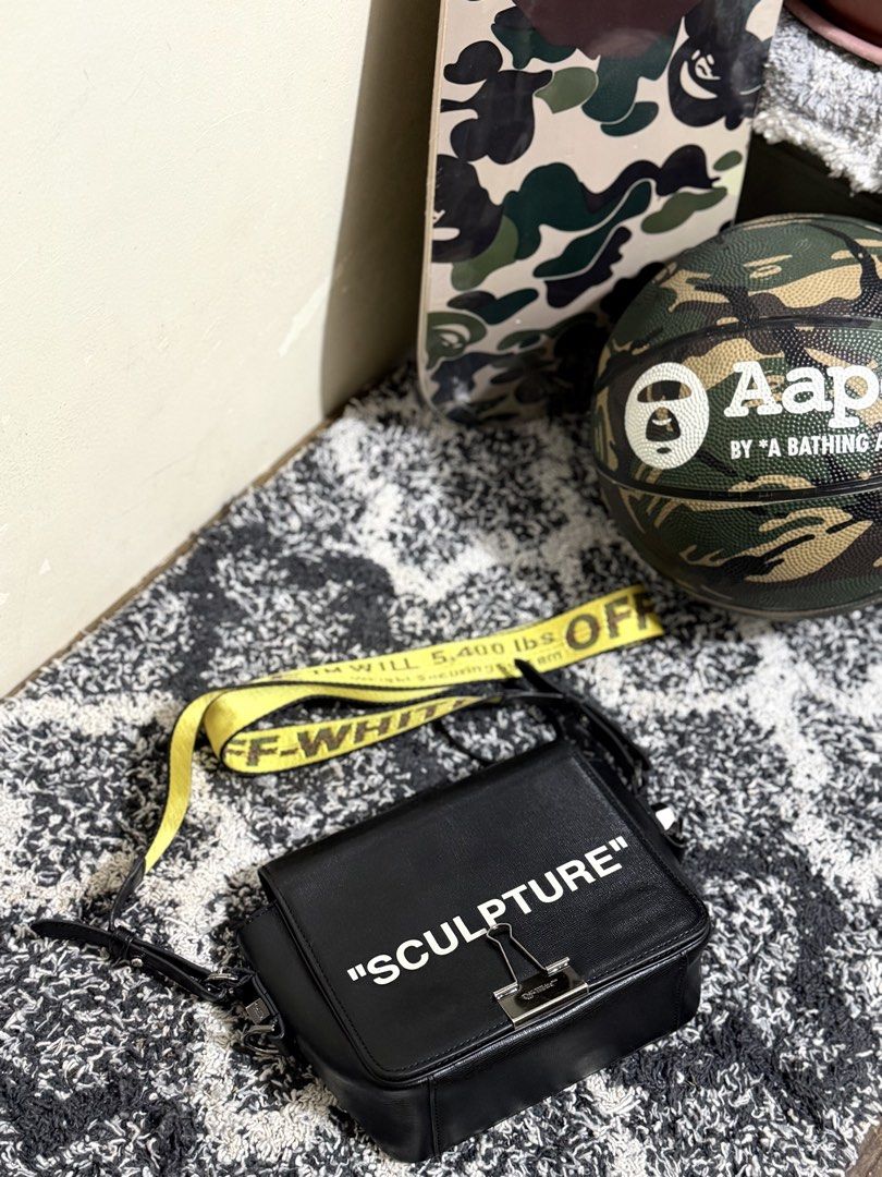 AUTHENTIC OFF-WHITE SCULPTURE BINDER CLIP BAG (Category: Luxury Bags & Wallets) located in Baguio. Submitted by snkr.essence (Listing ID 1433736668, Image 1). Description: OFF-WHITE ‘SCULPTURE’ BINDER CLIP BAG USED CONDITION ONE SIZE TWO WAY BAG ₱7,500 BAGUIO CITY LOCATED SHIPPING THRU J&T.
