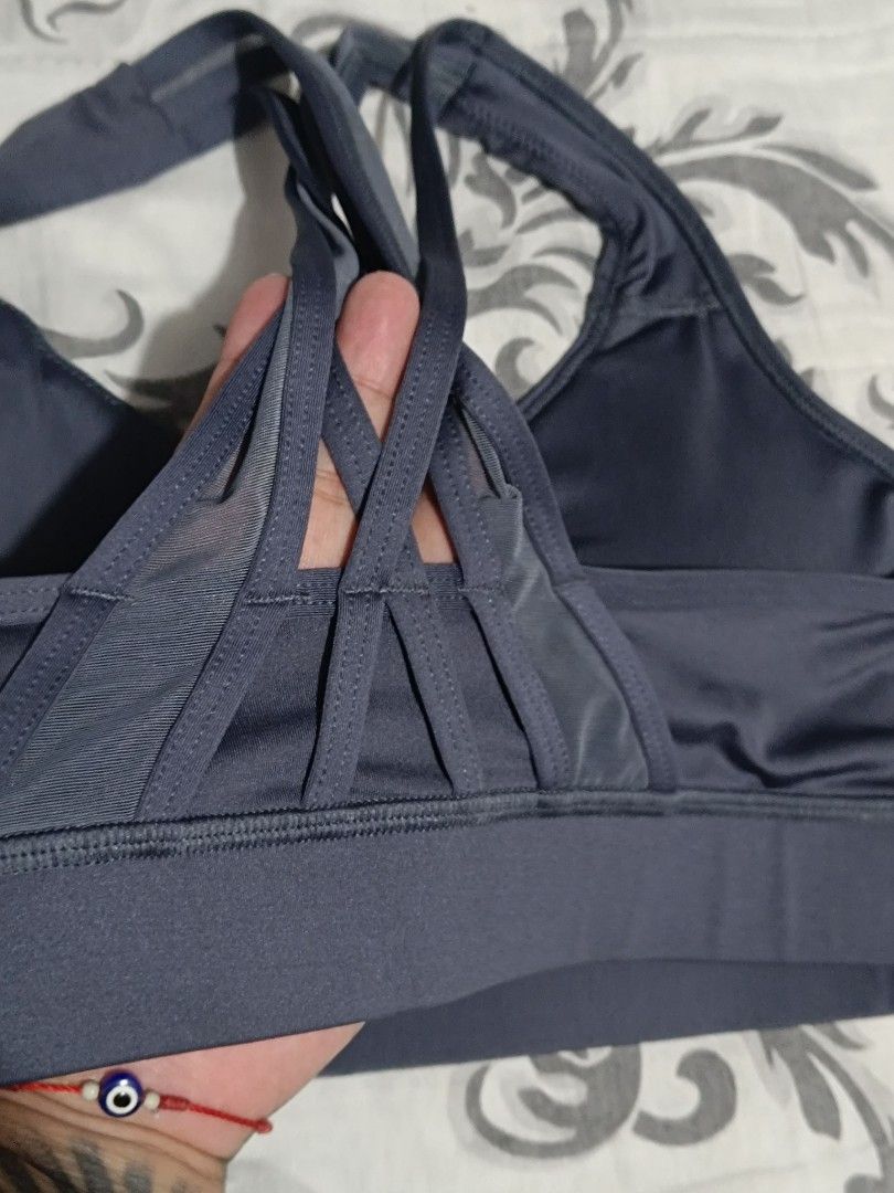 Avia Sportsbra Padded (Category: Activewear) located in Subic. Submitted by yssacollection (Listing ID 1433746297, Image 3). Description: Size: Medium (US Women's 8-10). Color: Dark Gray. Design: Scoop neckline for comfortable wear. Crossover back straps for added style and light support (visible in the thumbnail of the tag's back).
