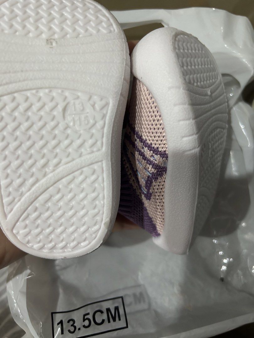 Baby Soft Sole Shoes 13.5cm (Category: Babies & Kids Fashion) located in Quezon City. Submitted by rde_03 (Listing ID 1433610170, Image 3). Description: - Soft sole for comfort - Breathable knit upper - Cute pink, purple, and blue color scheme - Size: 13.5cm - Convenient pull tab for easy wear - Flexible white soles.