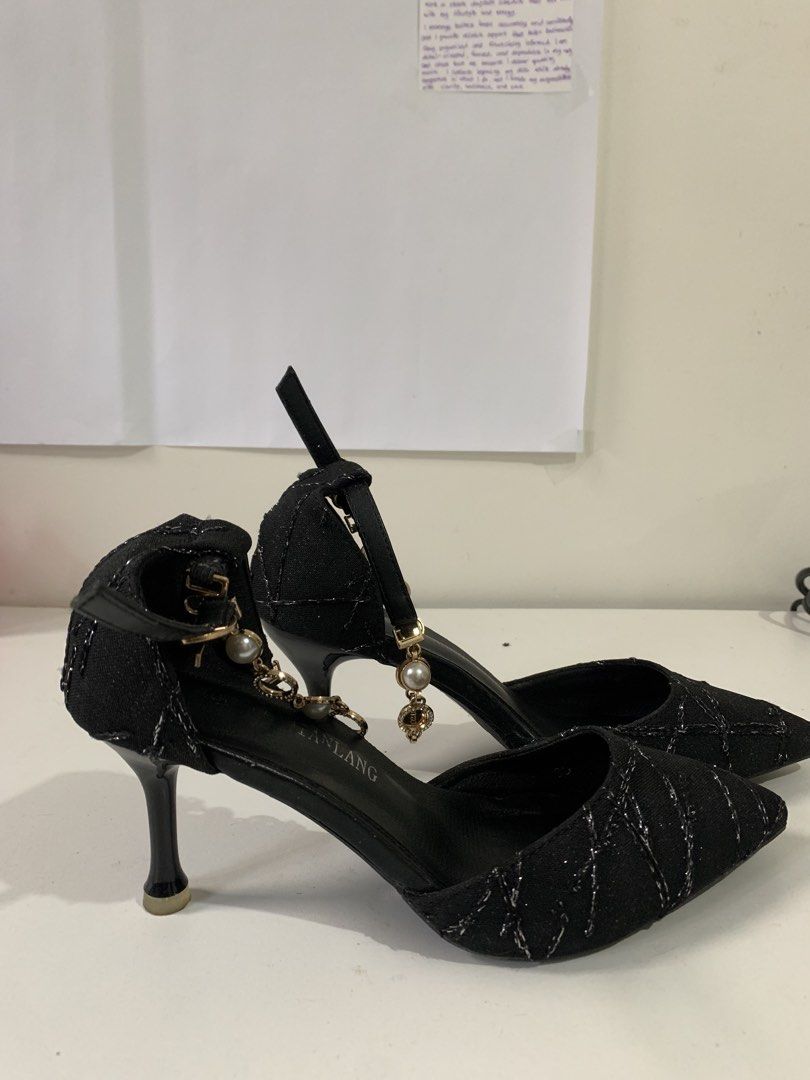 Black Heels with Pearl Details (Category: Heels) located in Pateros City. Submitted by Sparkle111 (Listing ID 1433668886, Image 1). Description: -Style: Black heels - Design: Pointed toe with strap and pearl chain - Features: Textured fabric with silver accents - Heel: Stiletto - Size: 35.