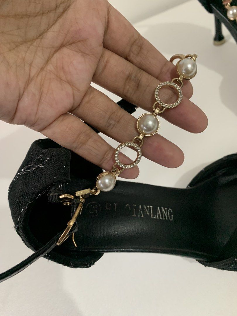 Black Heels with Pearl Details (Category: Heels) located in Pateros City. Submitted by Sparkle111 (Listing ID 1433668886, Image 2). Description: -Style: Black heels - Design: Pointed toe with strap and pearl chain - Features: Textured fabric with silver accents - Heel: Stiletto - Size: 35.