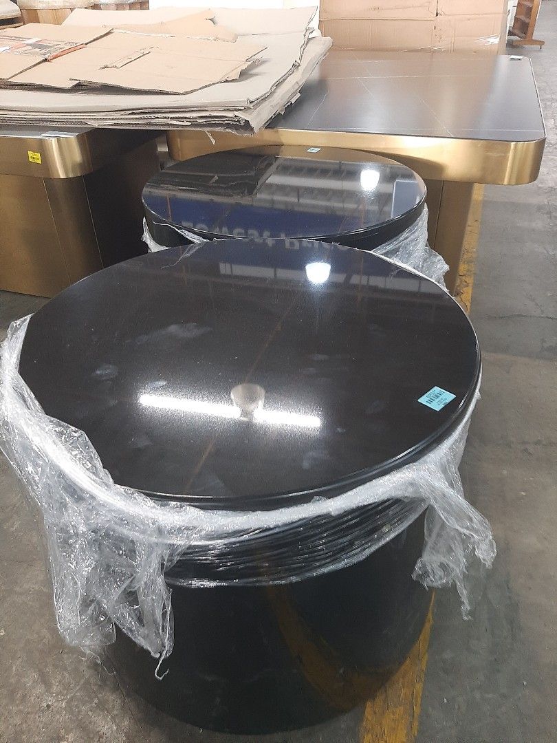 Black Round Coffee Table (Category: Tables & Sets) located in Manila. Submitted by mc_910319 (Listing ID 1433599362, Image 2). Description: - Round coffee table - Glossy black finish - Cylindrical base - Smooth, reflective surface - Suitable for living rooms/lounges - Wrapped in plastic.