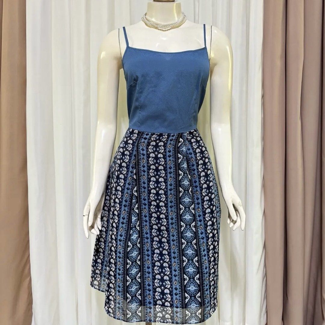 Blue Dress with Printed Skirt (Category: Dresses) located in Laoag. Submitted by duexatux (Listing ID 1433759581, Image 1). Description: -Size: S - Blue top with spaghetti straps - Blue and white floral patterned skirt - Knee-length - Ideal for casual or summer wear.