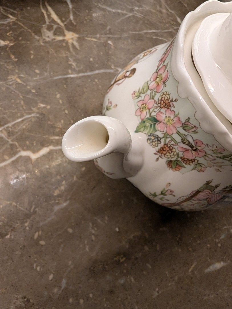 Bramble hedge Teapot (Category: Coffee & Tea Tableware) located in Midsayap. Submitted by Pandabearstore (Listing ID 1433636922, Image 3). Description: - Floral teapot with hedgehog design - White with pastel accents - Light blue handle - Unique handle and lid finial - Perfect for stylish tea serving.