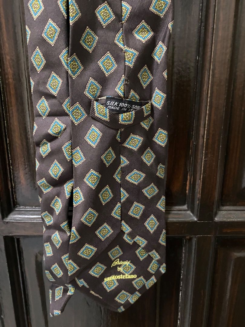 Brioni by Santostefano Silk Tie (Category: Ties) located in Manila. Submitted by haveago0dthrift (Listing ID 1433680814, Image 3). Description: - Brand: Brioni by Santostefano - Material: 100% Silk - Width 11cm - Length 144cm - Pattern: Repeating diamond - Colors: Brown, green, blue - Style: Classic formal/business tie.