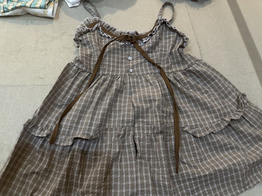 Coquette Brown Plaid Ruffle Dress (Category: Dresses) located in Manila. Submitted by imunchoneverything (Listing ID 1433638982, Image 1). Description: - Brown Plaid Ruffle Dress - Size: S - Features a plaid pattern - Adorned with ruffles and a bow detail - Ideal for casual wear Jnt or lalamove (if jnt, you have to book) Gcash or payment only.