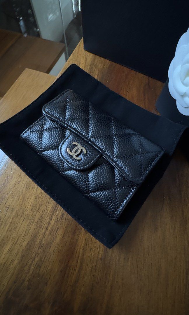 Chanel Card Holder (Category: Luxury Bags & Wallets) located in Plaridel. Submitted by kathtrene_alonzo39 (Listing ID 1433642288, Image 2). Description: -Unused - Authentic Chanel card holder - Classic black caviar design - Features the iconic CC logo - Includes original box - Comes with dust bag - Includes authenticity card - Chanel shopping bag included - Includes camellia flower.