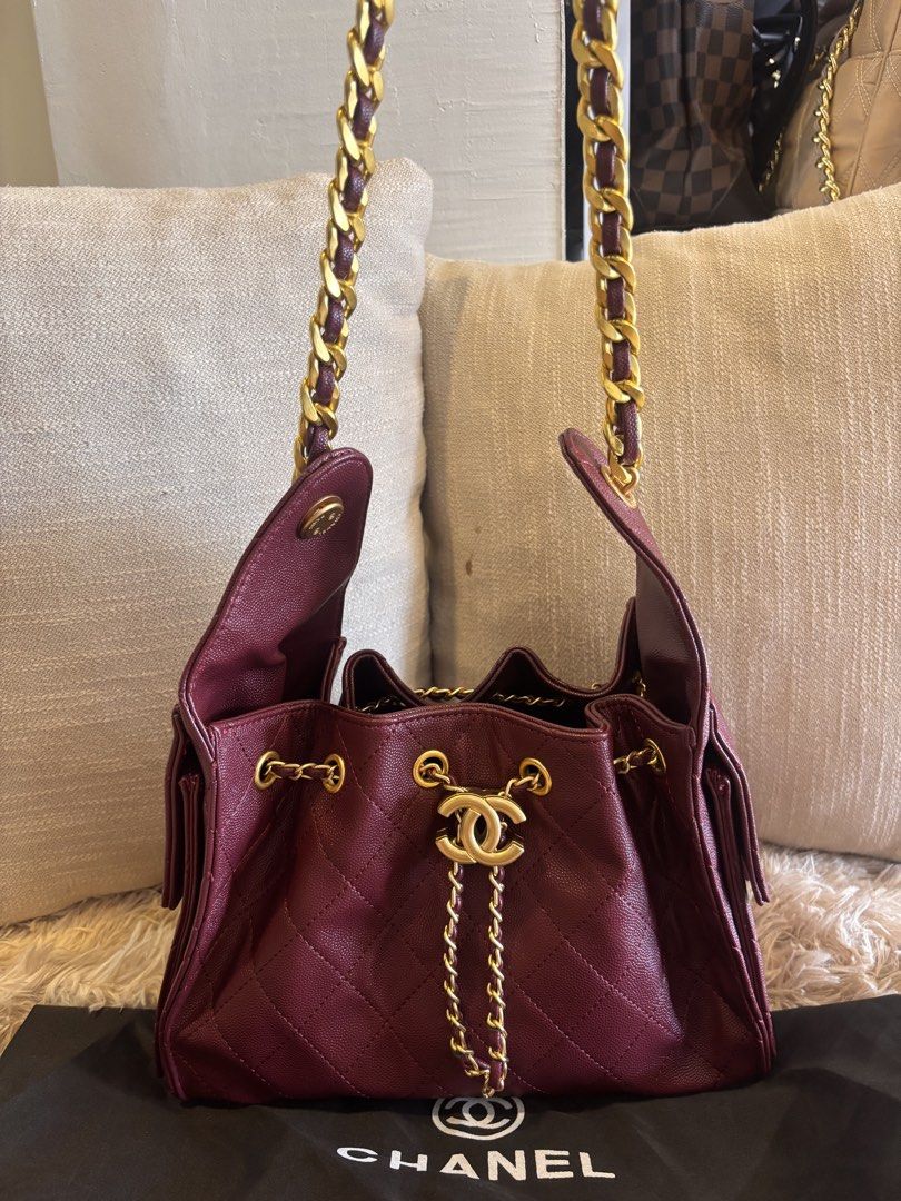 Chanel Drawstring Handbag with Chain Strap (Category: Luxury Bags & Wallets) located in Cebu City. Submitted by day.98 (Listing ID 1433593932, Image 2). Description: - Selected from japan surplus - Chanel burgundy handbag - Drawstring closure - Chain strap with gold-tone hardware - Quilted design - Iconic Chanel logo - Includes dust bag.