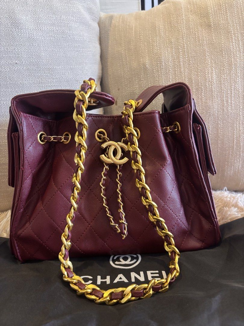 Chanel Drawstring Handbag with Chain Strap (Category: Luxury Bags & Wallets) located in Cebu City. Submitted by day.98 (Listing ID 1433593932, Image 1). Description: - Selected from japan surplus - Chanel burgundy handbag - Drawstring closure - Chain strap with gold-tone hardware - Quilted design - Iconic Chanel logo - Includes dust bag.