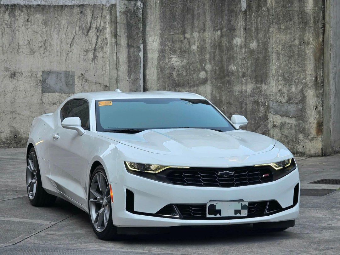 Chevrolet Camaro RS 2.0 Turbo Auto (Category: Used Cars) located in Manila. Submitted by quality_cars (Listing ID 1433756052, Image 2). Description: FORSALE/SWAP/FINANCING! Guaranteed best buy ✅️ GOOD AS BRANDNEW!! Almost 1.5M DISCOUNT FROM CASA PRICE. 2023 CAMARO RS!! 3K MILEAGE ONLY!! ORIGINAL or MONEYBACK! NAKA PLASTIC PA! Vehicle: 2023 CAMARO RS 2.0 TURBO Transmission: AT ODO Meter Reading: 3K (orig mileage or moneyback) Color: SUMMIT WHITE E