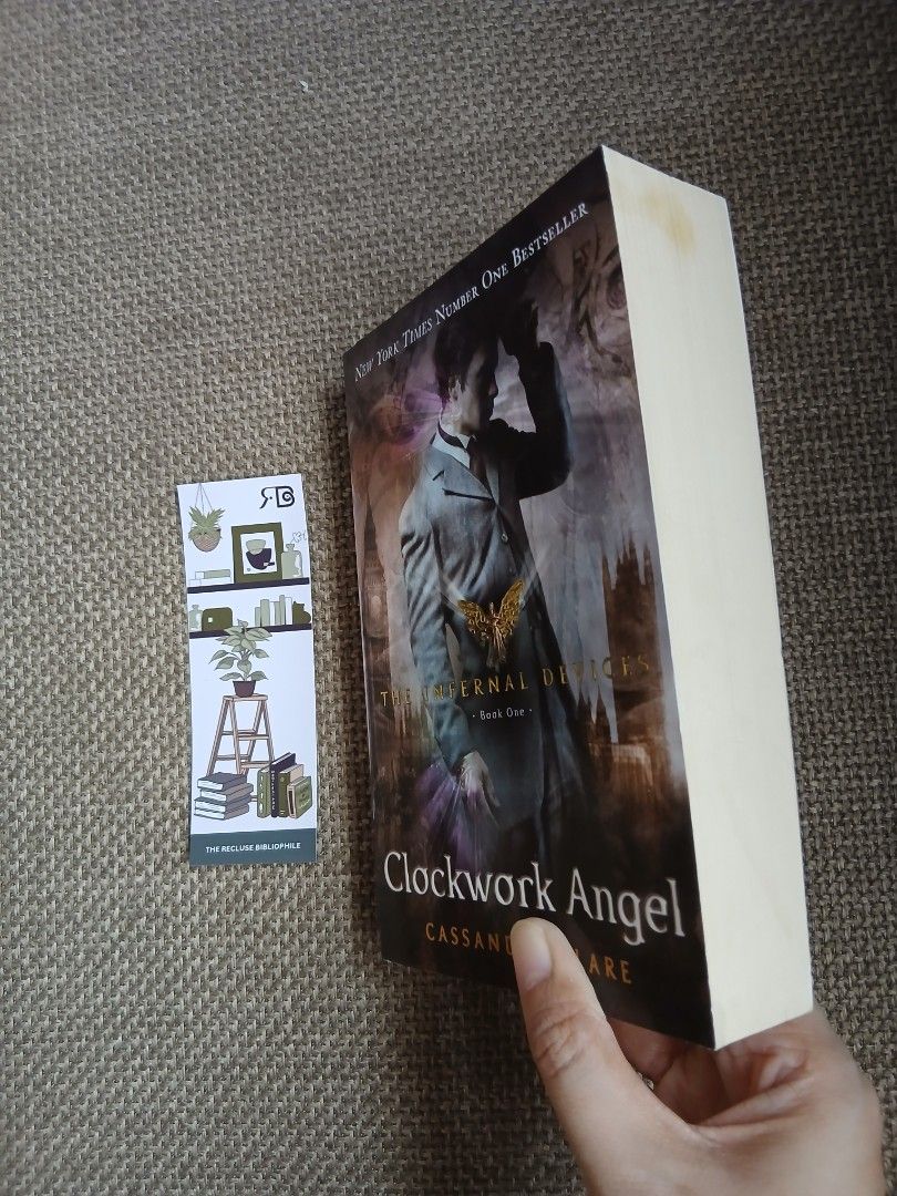 Clockwork Angel by Cassandra Clare (Category: Storybooks) located in Tarlac. Submitted by therecluse.bibliophileph (Listing ID 1433656334, Image 2). Description: - Clockwork Angel by Cassandra Clare - Includes a bookmark - English language - Features a cover with a person in a coat.